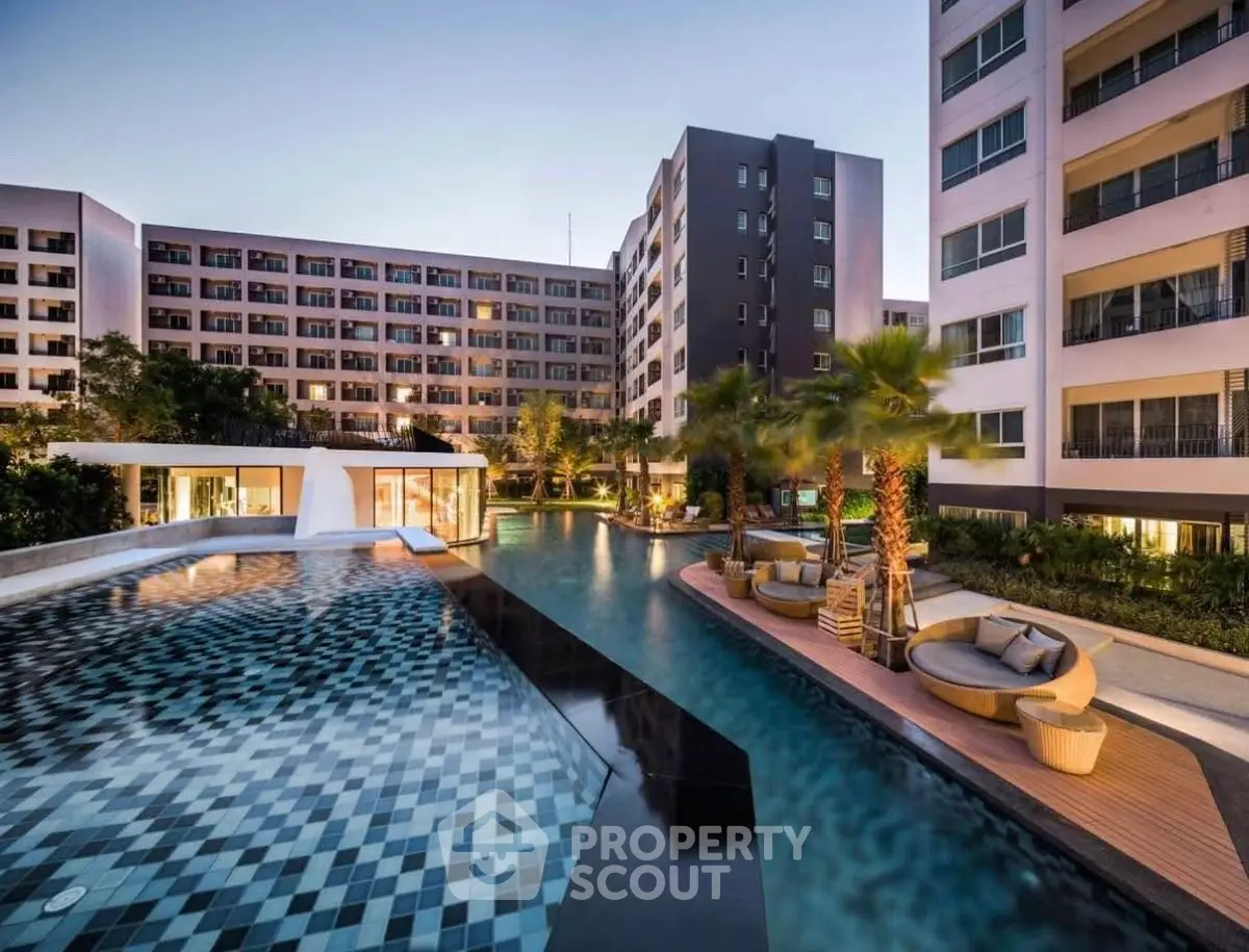 Luxurious apartment complex with stunning pool and modern design.