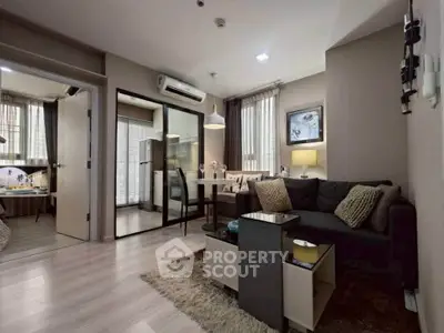 Modern living room with stylish decor and open layout in a cozy apartment.