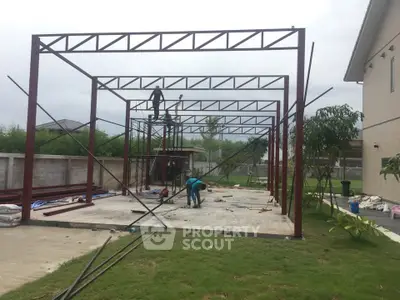 Construction site with steel frame structure in progress, showcasing future building development.