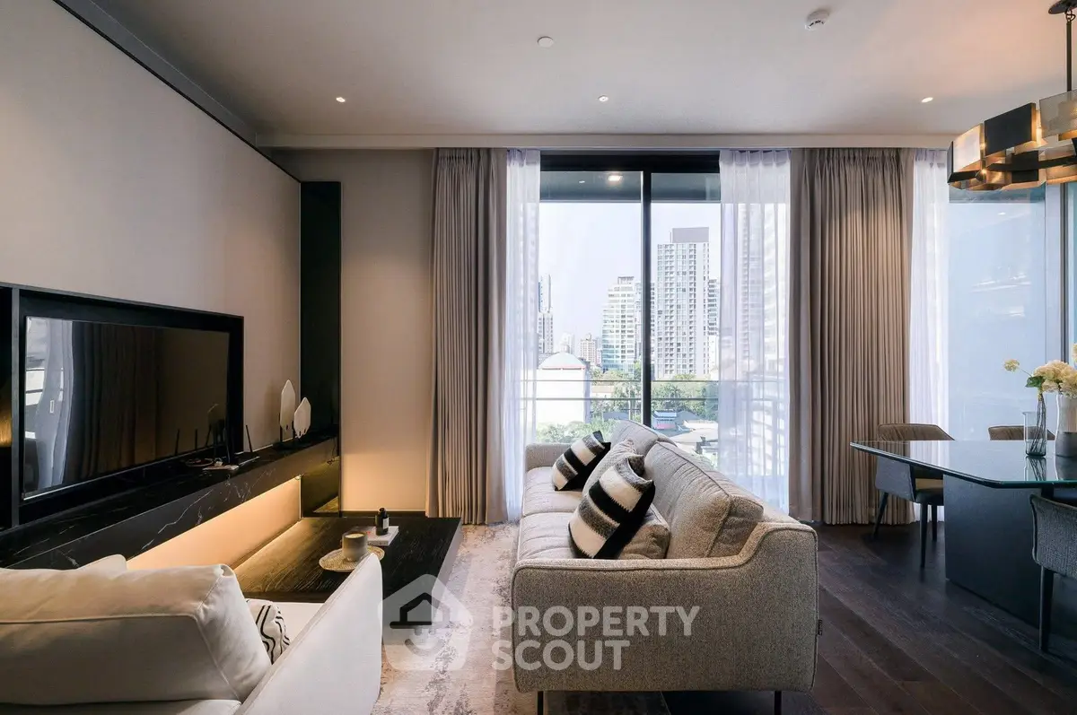 Luxurious modern living room with large windows and city view, featuring elegant furniture and stylish decor.