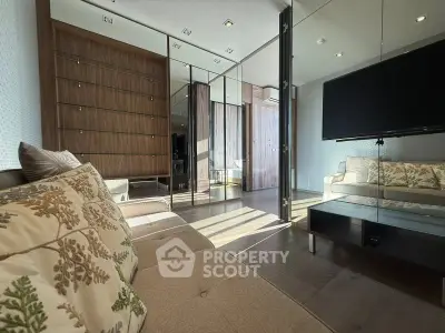Modern living room with elegant decor and large mirror wall