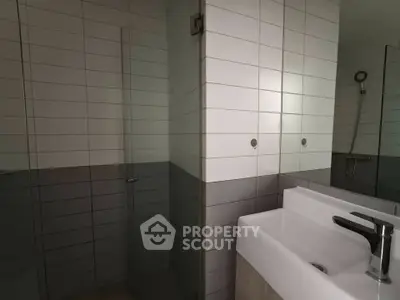 Modern bathroom with sleek tiles and contemporary fixtures