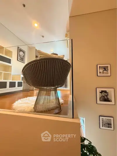 Stylish modern living room with unique chair and elegant decor