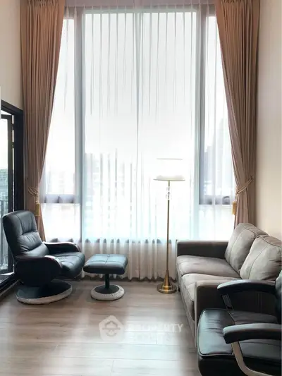 Elegant living room with high ceiling and modern furniture in a luxury apartment