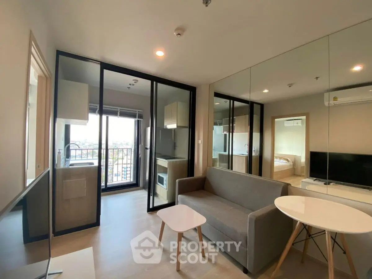 Modern living room with balcony and mirrored wall in a stylish apartment