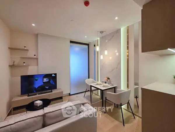 Modern living room with sleek furniture and ambient lighting, perfect for cozy evenings.
