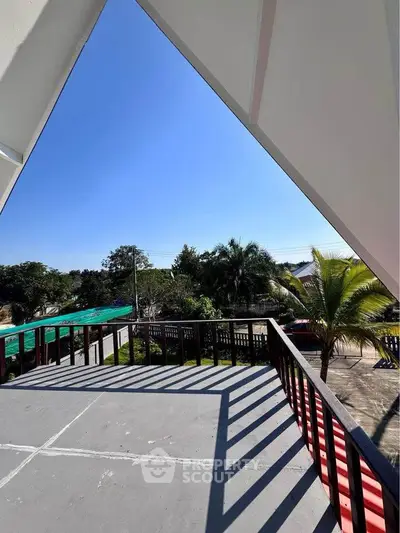 Spacious balcony with scenic view and modern railing design