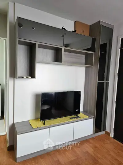 Modern living room with sleek TV unit and stylish storage cabinets