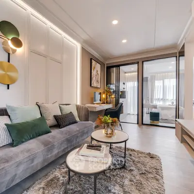 Luxurious modern living room with elegant decor and cozy ambiance, featuring plush sofa and stylish coffee tables.