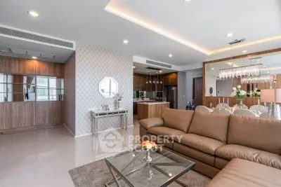 Luxurious modern living room with elegant decor and open kitchen layout, perfect for stylish urban living.