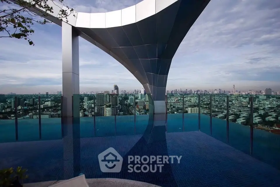 Stunning rooftop pool with panoramic city skyline views, perfect for luxury urban living.