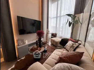 Luxurious modern living room with stylish decor and large windows offering city views.