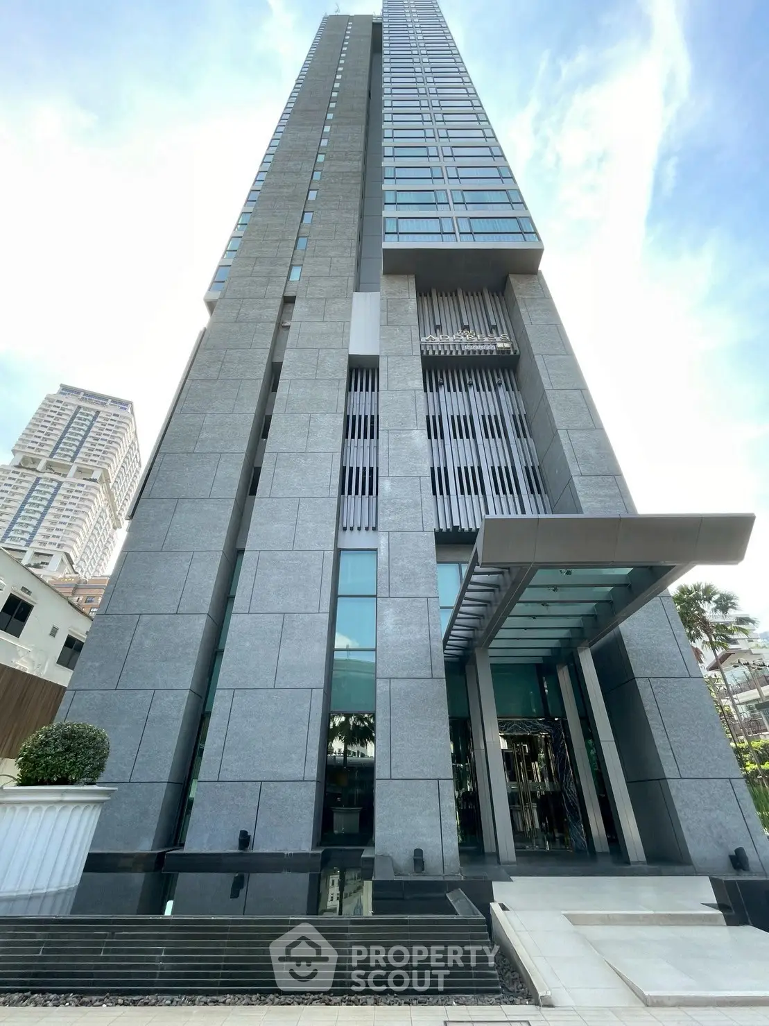 Stunning modern high-rise building with sleek architectural design and impressive entrance.