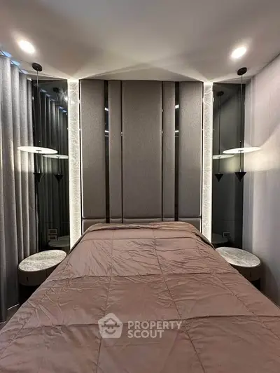 Luxurious bedroom with modern lighting and elegant decor, perfect for relaxation and comfort.