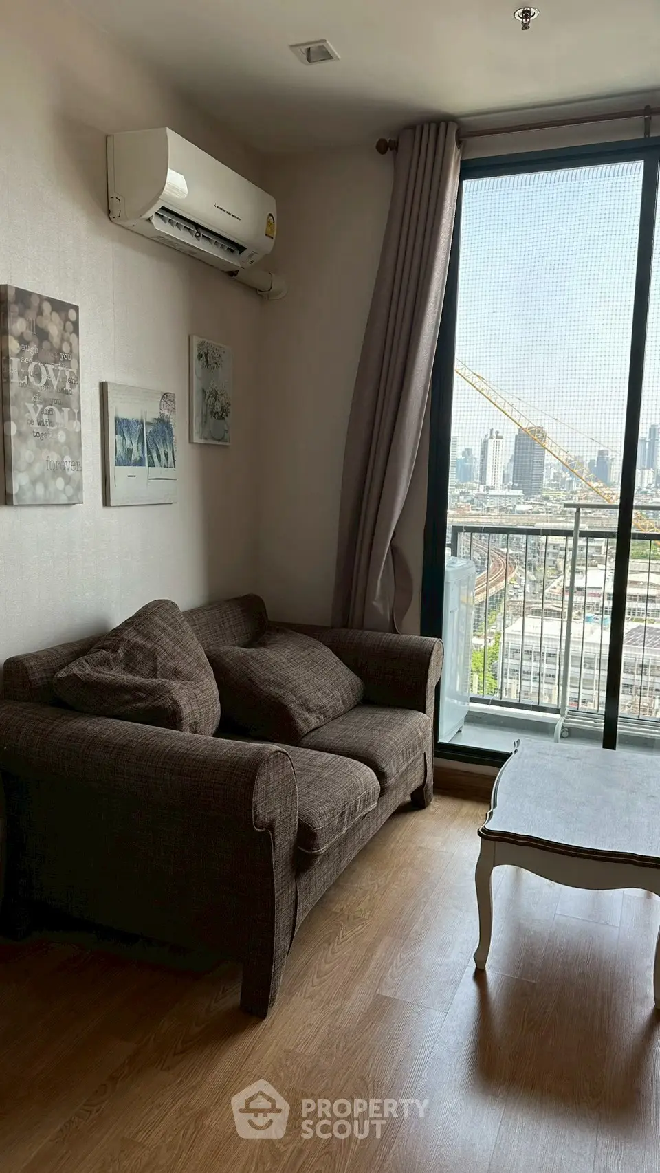 Cozy living room with city view and stylish decor