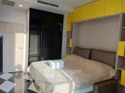 Modern bedroom with stylish yellow accents and cozy bedding