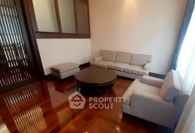 Elegant living room with polished wooden floors and modern furniture