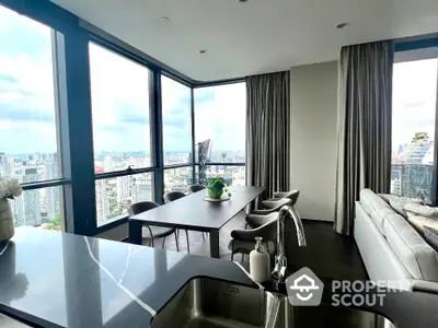 Luxurious modern living room with panoramic city views and elegant furnishings.