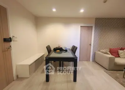 Modern dining area with sleek table and cozy seating in stylish apartment