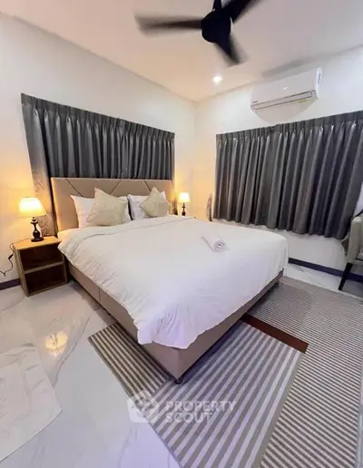 Luxurious bedroom with modern decor and cozy ambiance