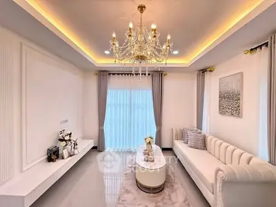 Luxurious living room with elegant chandelier and modern decor