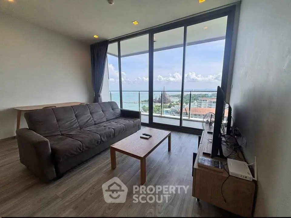 Spacious living room with stunning ocean view and modern furnishings