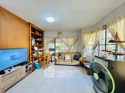 Spacious living room with natural light and modern furnishings