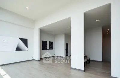 Spacious modern living room with high ceilings and minimalist decor