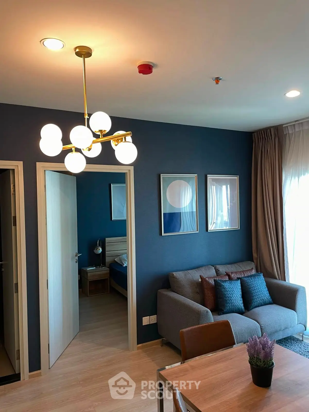 Modern living room with stylish decor and cozy seating area in a contemporary apartment.