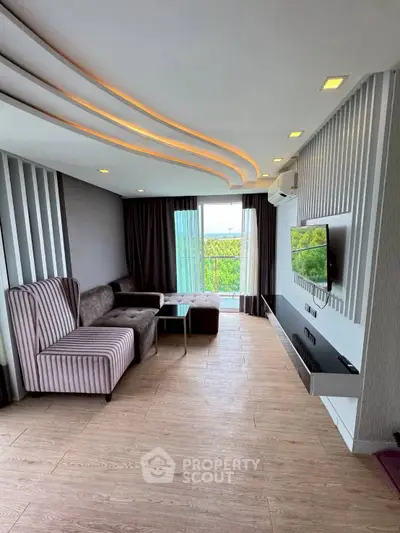Modern living room with stylish decor and balcony view