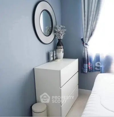 Chic bedroom corner with modern dresser and stylish decor