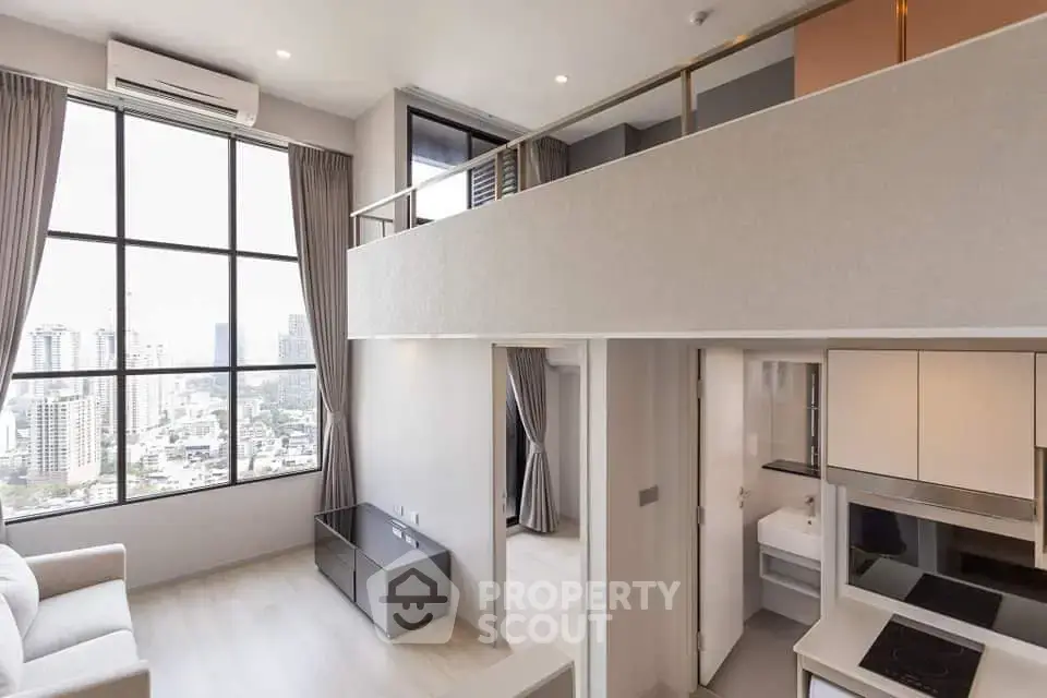 Modern loft apartment with large windows and city view, featuring open living space and mezzanine.