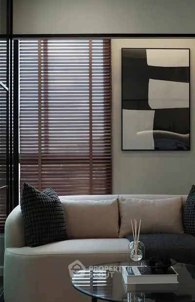 Stylish modern living room with elegant decor and natural light.