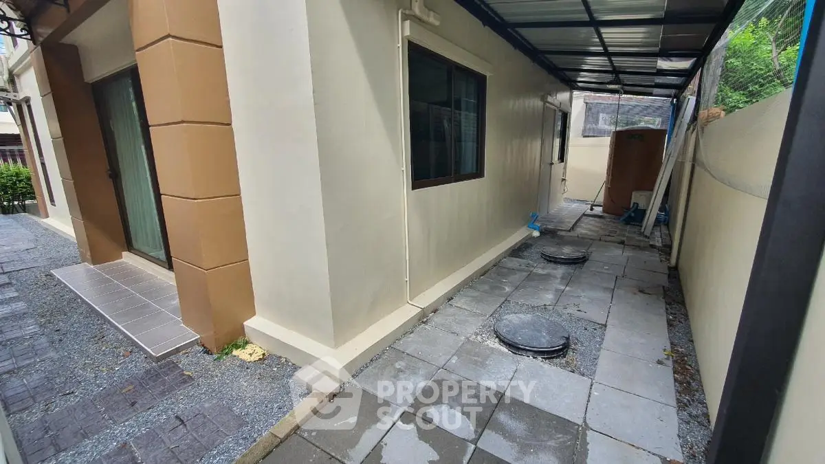 Spacious exterior walkway with modern design and covered roof