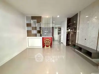 Spacious modern living room with sleek design and glossy floors, perfect for stylish urban living.