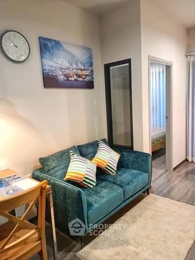 Charming living room with cozy teal sofa and modern decor