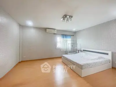 Spacious minimalist bedroom with modern design and natural light