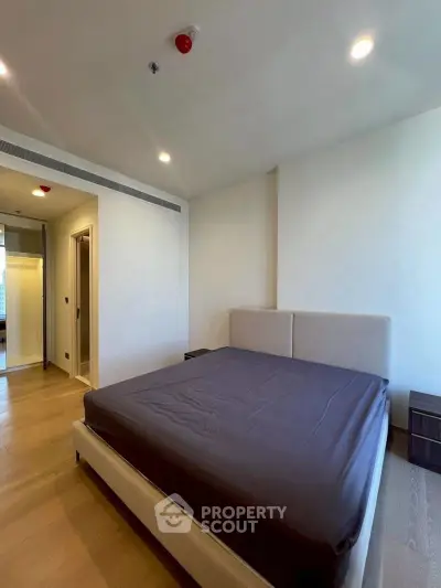 Spacious modern bedroom with sleek design and ample natural light