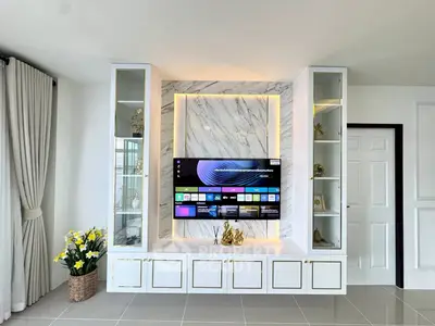 Luxurious living room with modern TV setup and elegant decor