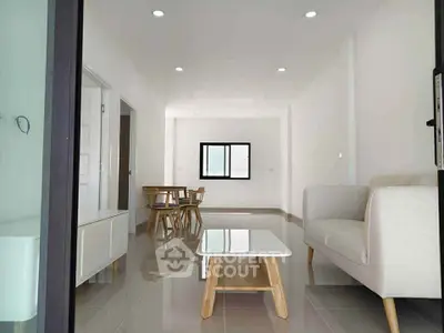 Spacious modern living room with sleek furniture and natural light