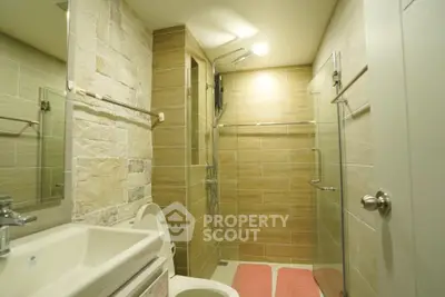 Modern bathroom with glass shower and stylish tile design
