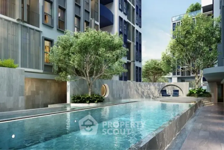 Luxurious modern apartment complex with stunning pool and lush greenery.