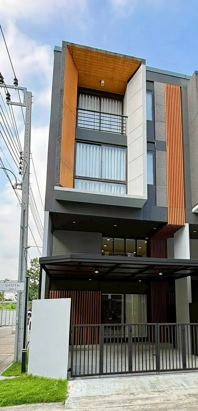 Modern townhouse exterior with contemporary design and large windows