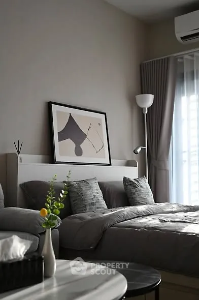 Modern bedroom with stylish decor and natural light
