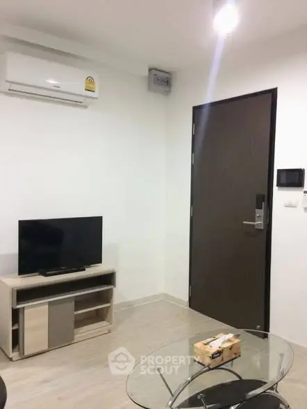 Modern living room with air conditioning and sleek furniture in a stylish apartment.