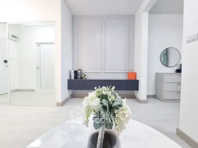 Modern living room with elegant decor and stylish furniture, perfect for contemporary living.