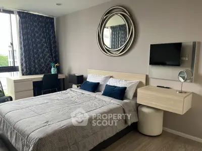 Modern bedroom with stylish decor and large window view