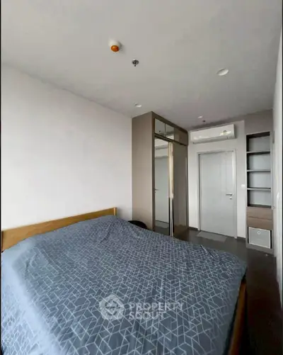 Modern bedroom with sleek design and ample storage space