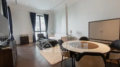 Elegant living room with modern furniture and large window view