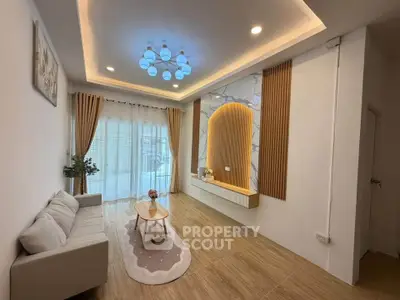 Modern living room with elegant lighting and stylish decor